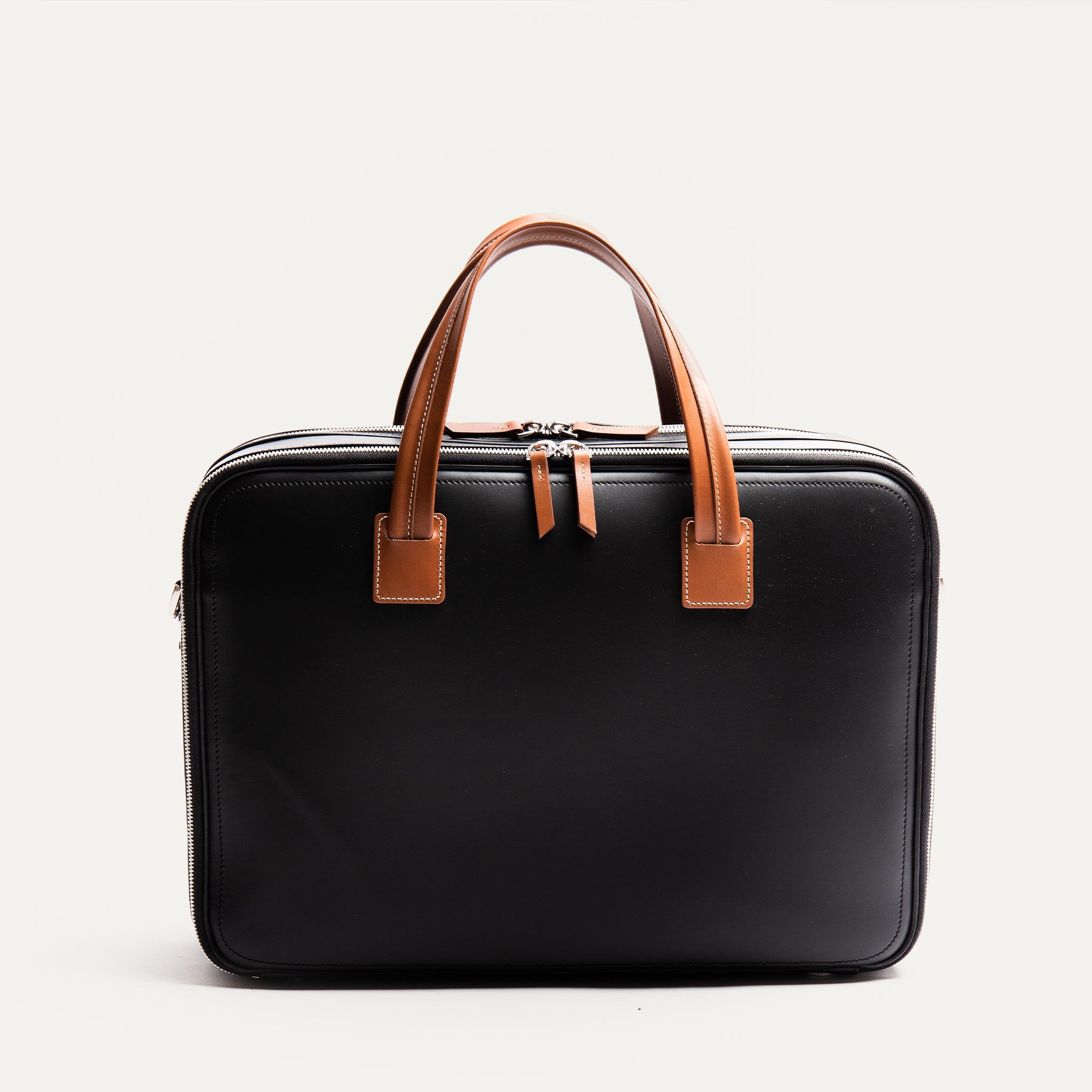 Briefcase en cuir noir et cognac.
